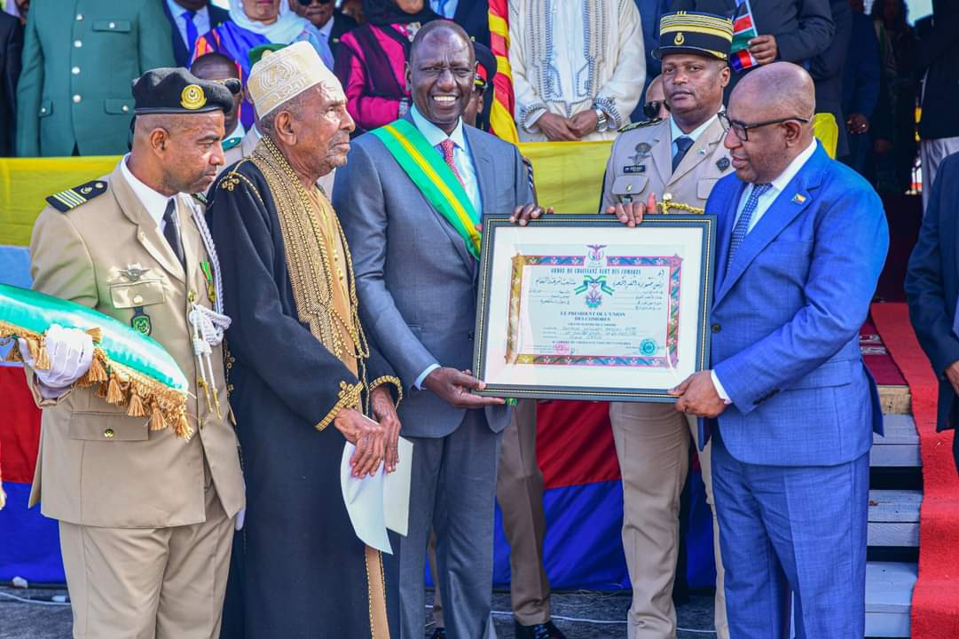 File image of President William Ruto being given the Grand Cross of the Green Crescent of Comoros award.